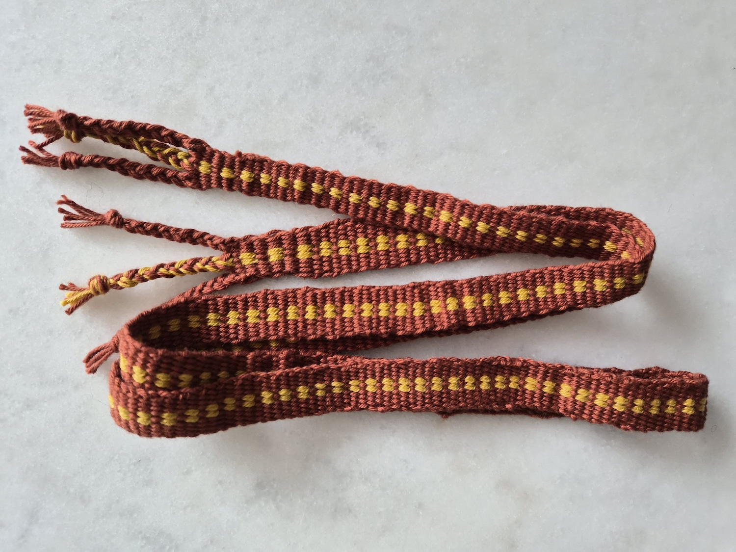 A weft faced band weave