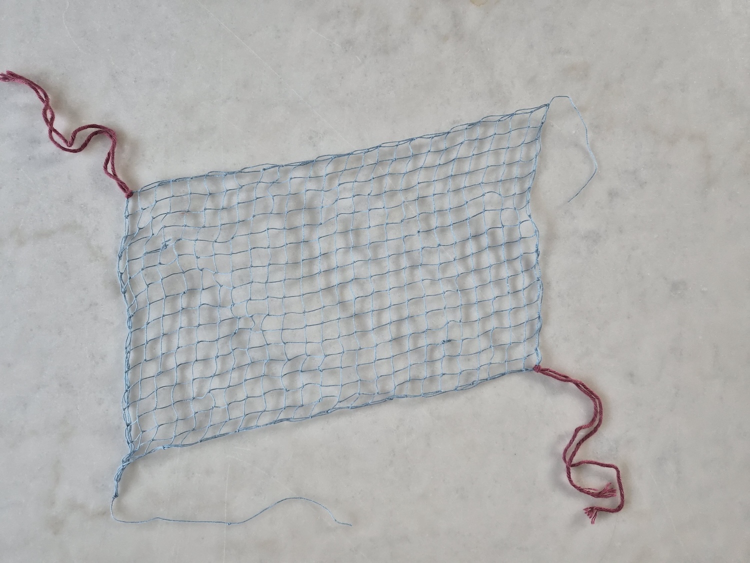 A rectangular net tied using the filet lace kit