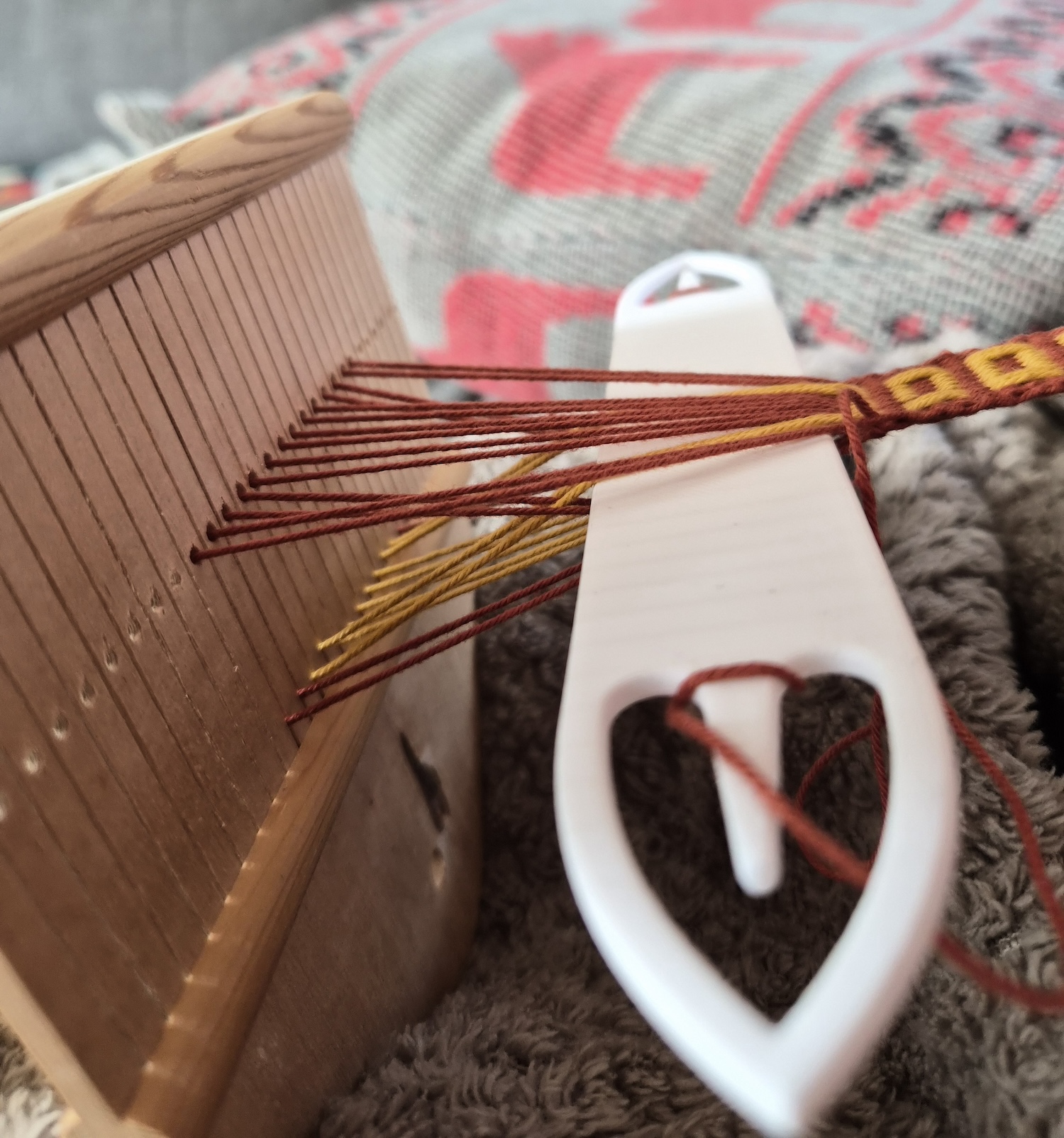 Looking at a simple pickup weave in the middle of picking up the pattern. View from the side.