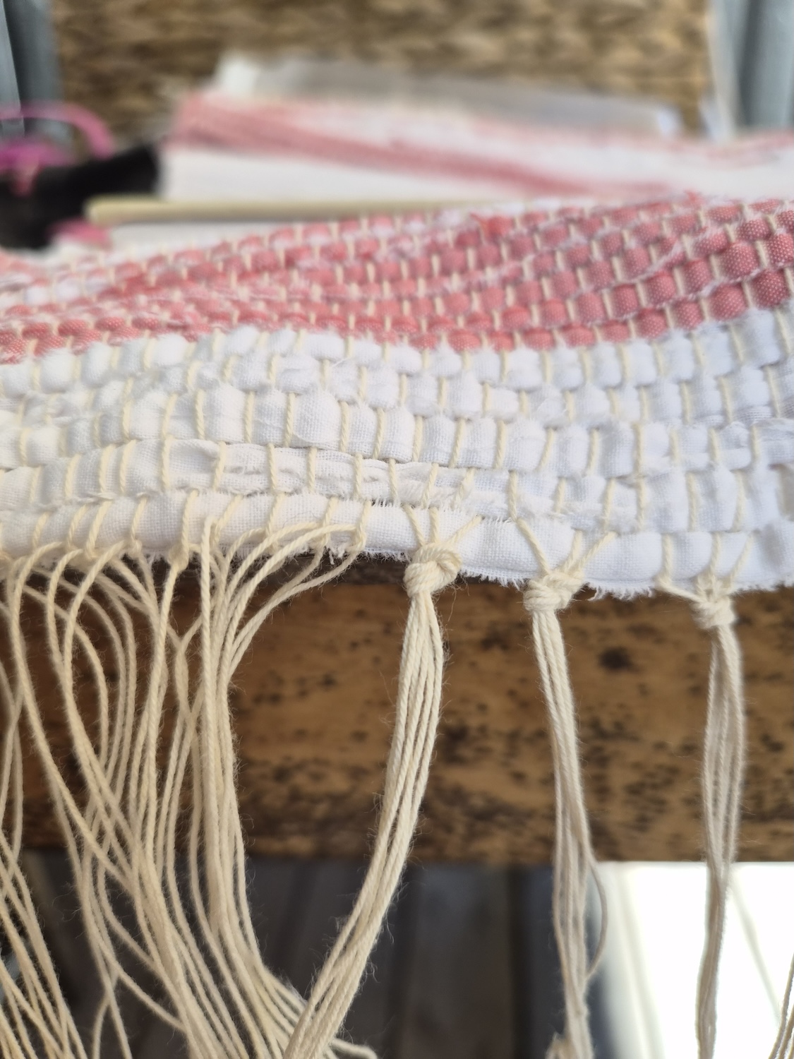 Closeup of tying the ends of a rug carpet table runner